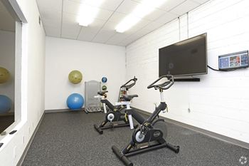 Lifestyle on demand room featuring two stationary bicycles